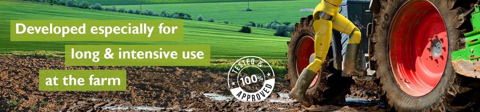 Tractor with red wheels on a farm field, promoting durability for agricultural use.